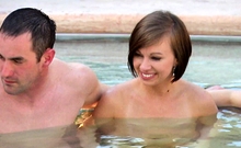 Couples Surround Each Other At Hot Tub