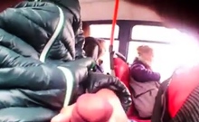 Two girls watch bus flasher