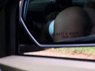 Black slut sucking dick in front seat of car