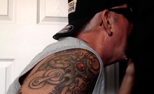 Gloryhole tattooed gaydaddy sucks cock