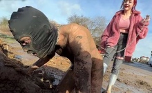 Extreme ballbusting in the mud Miss Eva Ray